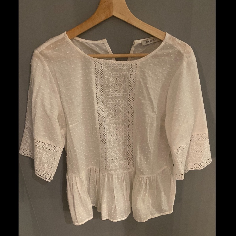 White peplum top